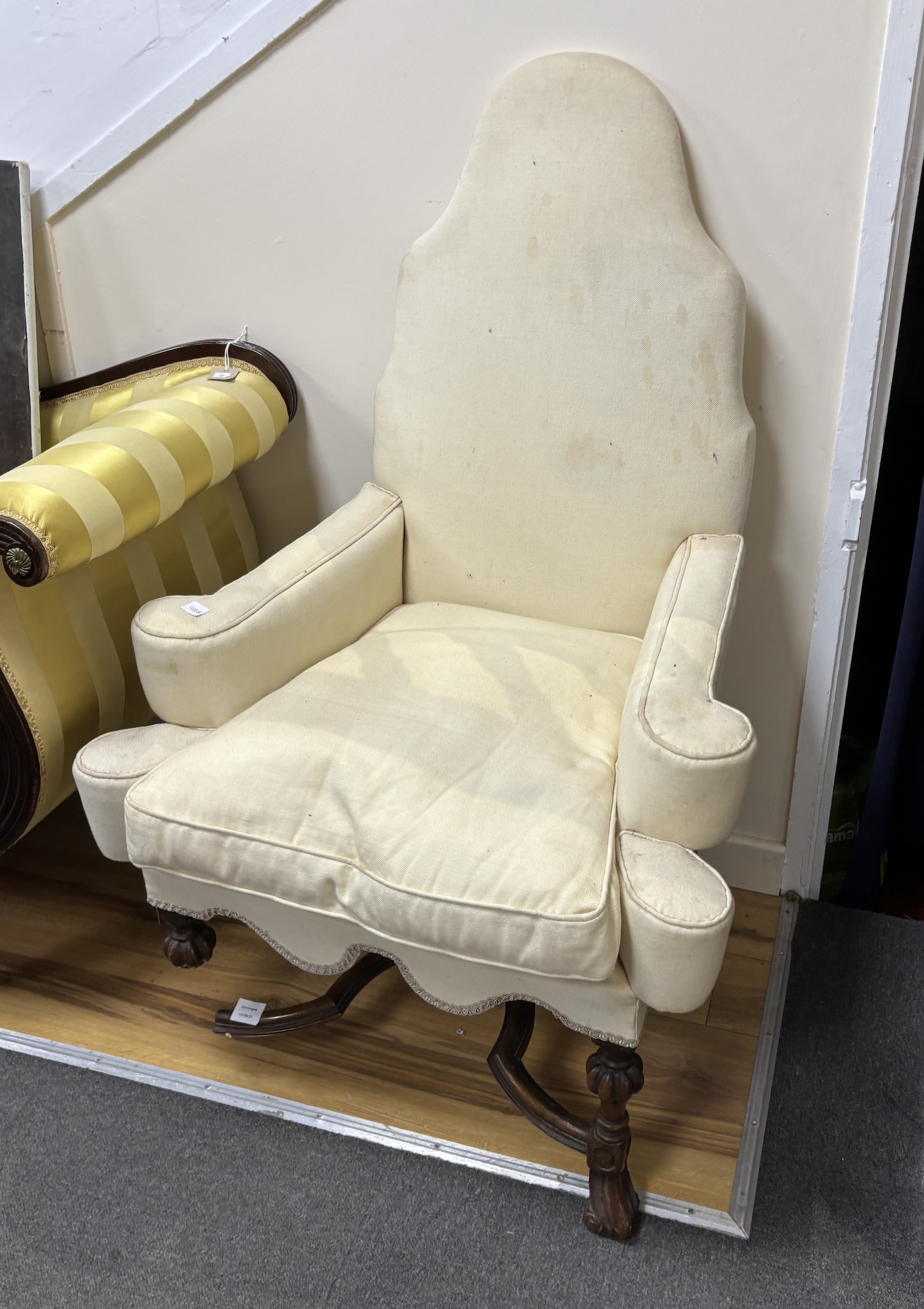 A George I style walnut upholstered armchair (in need of restoration), width 80cm, depth 73cm, height 122cm, Provenance- Brede Place, East Sussex, a former residence of the Frewen family from 1712-1936.